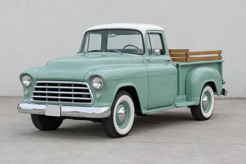 The same pickup as an ordinary photograph on grey concrete, before the painting